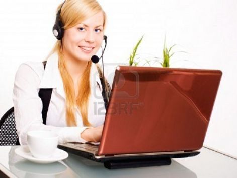 5934029-smiling-blond-woman-working-with-computer-in-office.jpg
